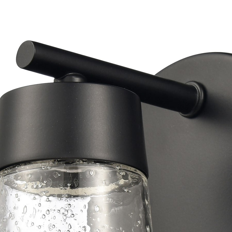 Atlas Lighting Jergen 5in 1-Light Vanity Light | Modern Matte Black and Clear Seeded Glass | Bathroom Vanity | 5 x 5 x 6.25 in | Model WL11349-BK