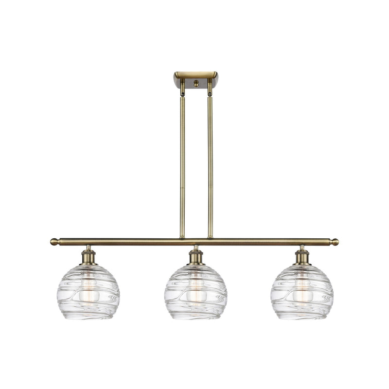 Innovations Athens Deco Swirl 36in 3-Light Island Light | Industrial Antique Brass and Clear Deco Swirl Glass | Kitchen | Model 516-3I-AB-G1213-8CL