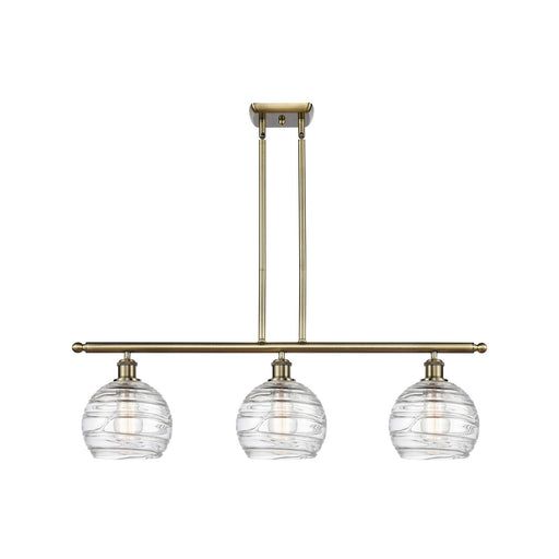 Innovations Athens Deco Swirl 36in 3-Light Island Light | Industrial Antique Brass and Clear Deco Swirl Glass | Kitchen | Model 516-3I-AB-G1213-8CL