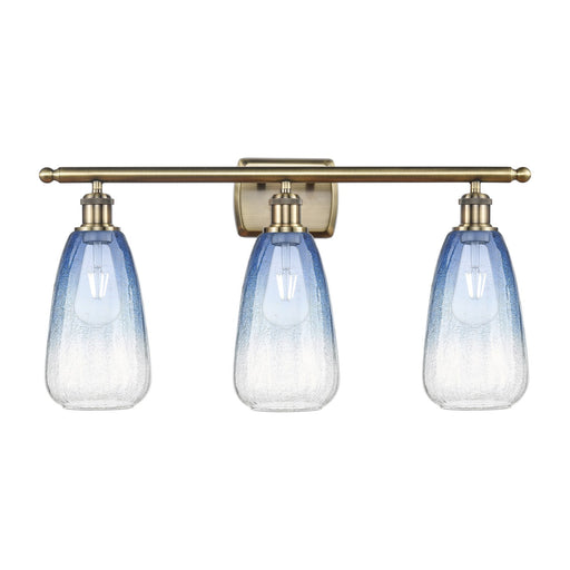 Innovations Brookhaven Almond 26in 3-Light Bath Vanity Light | Industrial Antique Brass Steel and Sapphire Blue Glass | Model 516-3W-AB-G480-6SB