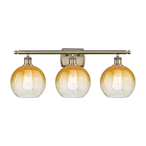 Innovations Brookhaven Globe 28in 3-Light Bath Vanity Light | Industrial Antique Brass and Amber Glass | Bathroom Vanity | Model 516-3W-AB-G483-8AM