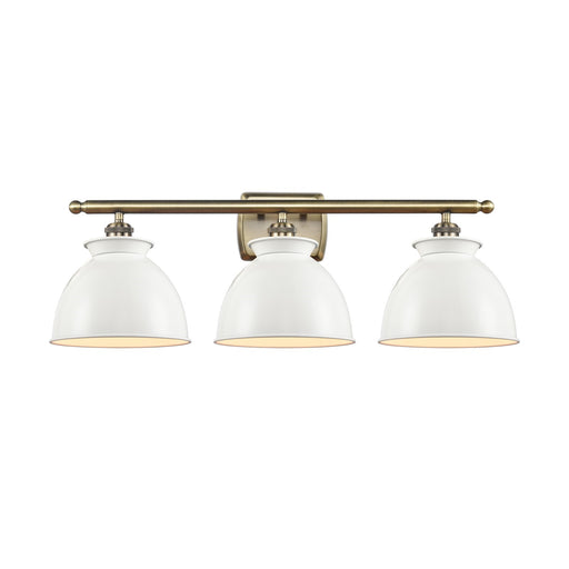 Innovations Adirondack 28in 3-Light Bath Vanity | Industrial Farmhouse Antique Brass Steel and Glossy White Metal Shade | Bathroom | Model 516-3W-AB-M14-W