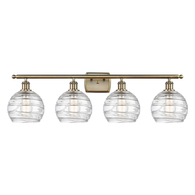 Innovations Athens Deco Swirl 38in 4-Light Bath Vanity Light | Industrial Antique Brass Steel and Clear Deco Swirl Glass | Model 516-4W-AB-G1213-8CL