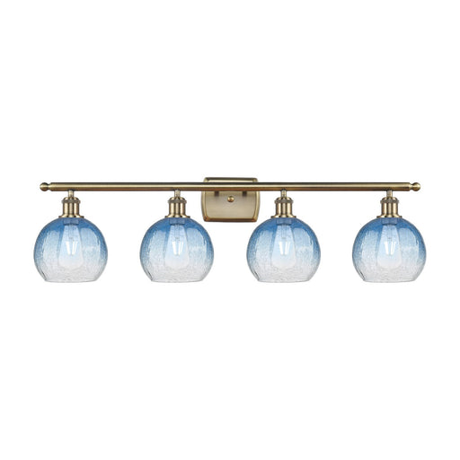 Innovations Brookhaven Globe 38in 4-Light Bath Vanity Light | Industrial Antique Brass Steel and Sapphire Blue Glass | Bathroom | Model 516-4W-AB-G483-8SB