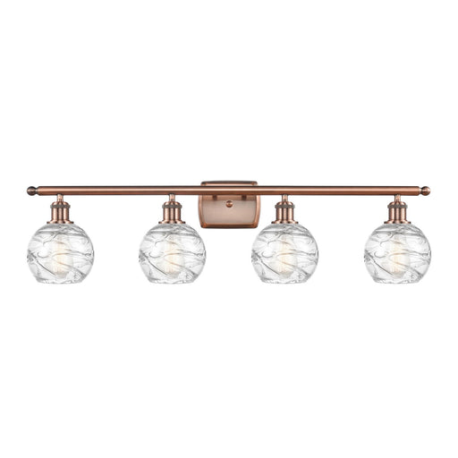 Innovations Athens Deco Swirl 36in 4-Light Bath Vanity Light | Industrial Antique Copper Steel and Clear Glass | Bathroom | Model 516-4W-AC-G1213-6CL