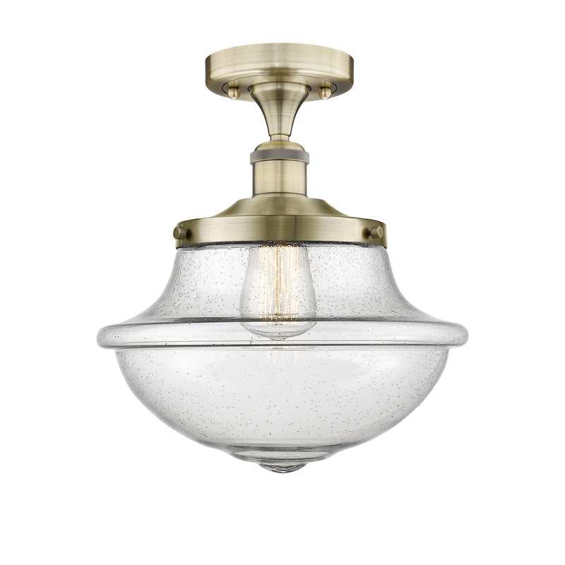 Innovations Oxford 12in 1-Light Semi-Flush Mount | Industrial Antique Brass Steel and Seedy Glass | Entryway & Hallway | 11.75 x | Model 616-1F-AB-G544