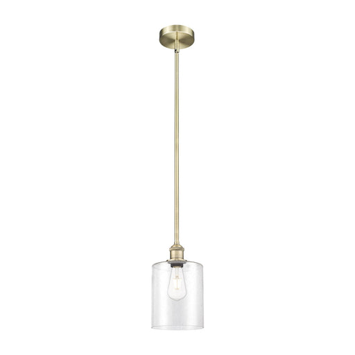Innovations Paladin 7in 1-Light Mini Pendant | Farmhouse Antique Brass Steel and Seedy Glass Cylinder | Kitchen Island & Dining | Model 616-1S-AB-G4424-7