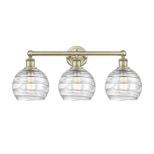 Innovations Athens Deco Swirl 26in 3-Light Bath Vanity Light | Industrial Antique Brass and Clear Deco Swirl Glass | Bathroom | Model 616-3W-AB-G1213-8CL
