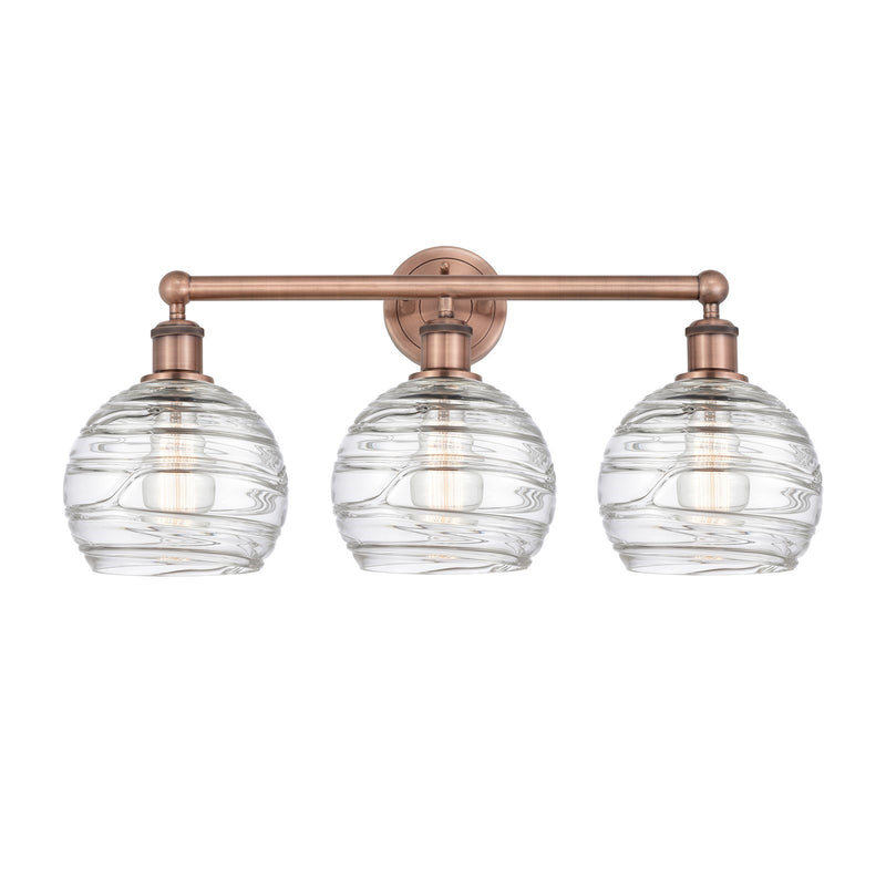 Innovations Athens Deco Swirl 26in 3-Light Bath Vanity Light | Industrial Antique Copper Steel and Clear Deco Swirl Glass | Model 616-3W-AC-G1213-8CL