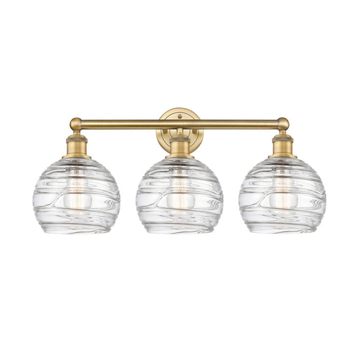 Innovations Athens Deco Swirl 26in 3-Light Bath Vanity | Industrial Brushed Brass Steel and Clear Deco Swirl Glass | Bathroom | Model 616-3W-BB-G1213-8CL