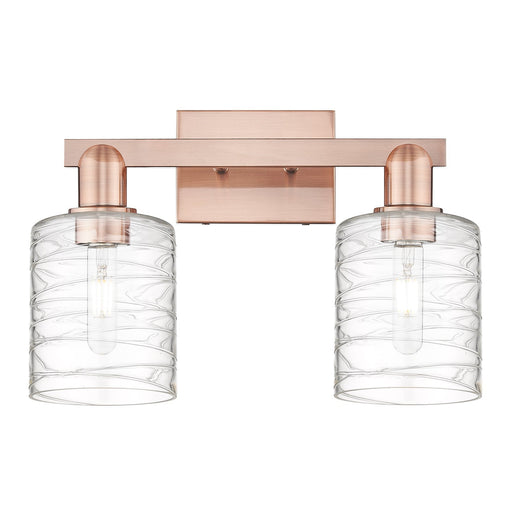 Innovations Cobbleskill 16in 2-Light Bath Vanity | Industrial Antique Copper Steel and Deco Swirl Glass | Bathroom Vanity Light | Model 716-2W-AC-G1113