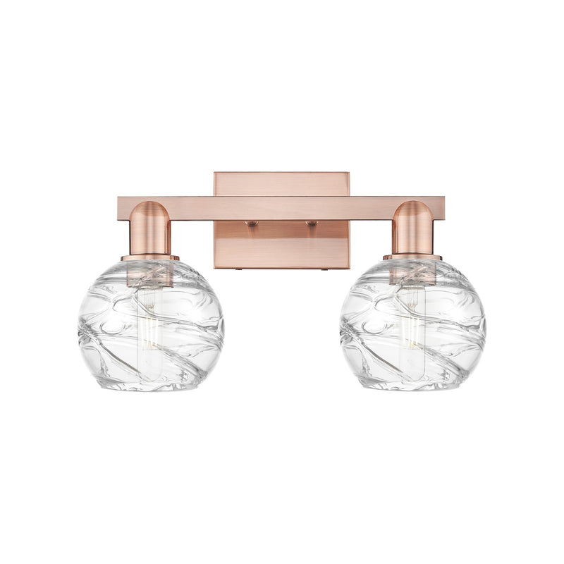 Innovations Athens Deco Swirl 16.88in 2-Light Bath Vanity Light | Industrial Antique Copper Steel and Clear Glass | Bathroom | Model 716-2W-AC-G1213-6CL