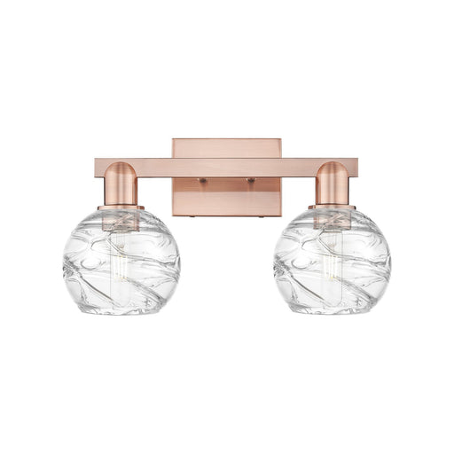 Innovations Athens Deco Swirl 16.88in 2-Light Bath Vanity Light | Industrial Antique Copper Steel and Clear Glass | Bathroom | Model 716-2W-AC-G1213-6CL