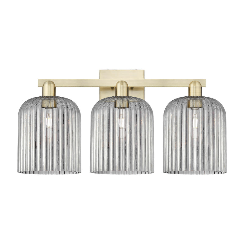 Innovations Bridal Veil 27in 3-Light Bath Vanity | Industrial Antique Brass and Light Smoke Ribbed Glass | Bathroom Vanity | Model 716-3W-AB-G559-8SM
