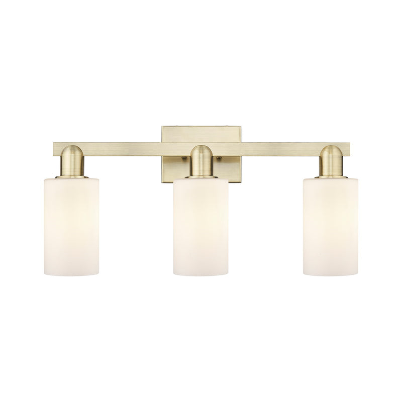 Innovations Clymer 23in 3-Light Bath Vanity Light | Industrial Antique Brass Steel and Matte White Glass | Bathroom Vanity | 22.88 | Model 716-3W-AB-G801
