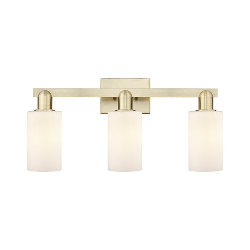 Innovations Clymer 23in 3-Light Bath Vanity Light | Industrial Antique Brass Steel and Matte White Glass | Bathroom Vanity | 22.88 | Model 716-3W-AB-G801