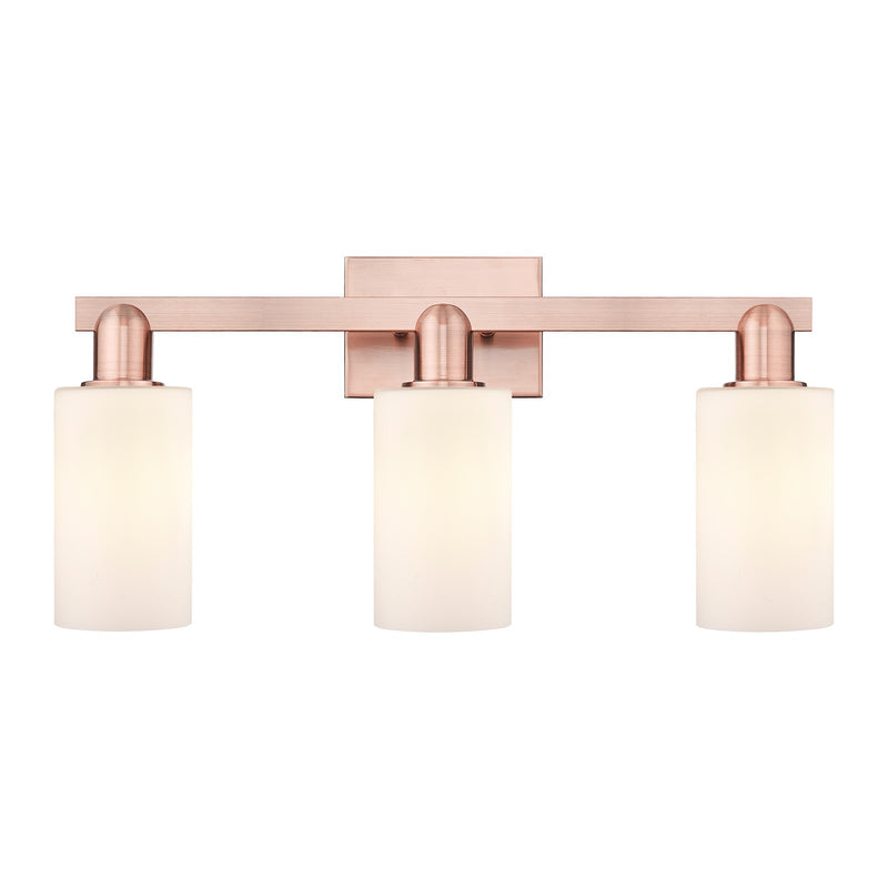 Innovations Clymer 23in 3-Light Bath Vanity Light | Industrial Antique Copper Steel and Matte White Glass | Bathroom Vanity | 22.88 | Model 716-3W-AC-G801