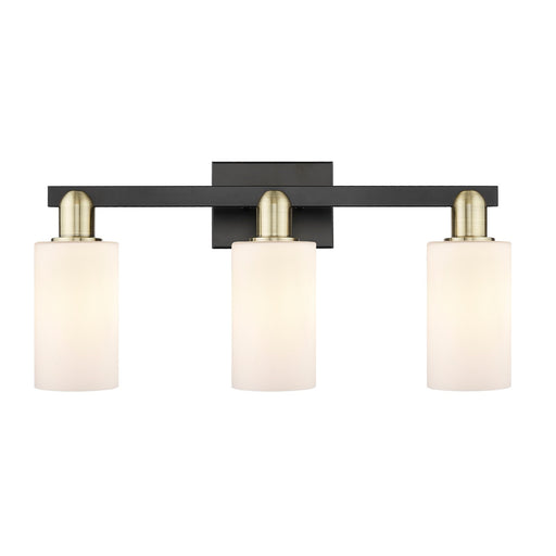 Innovations Clymer 23in 3-Light Bath Vanity | Industrial Black Antique Brass and Matte White Glass | Bathroom Vanity Light | 22.88 | Model 716-3W-BAB-G801