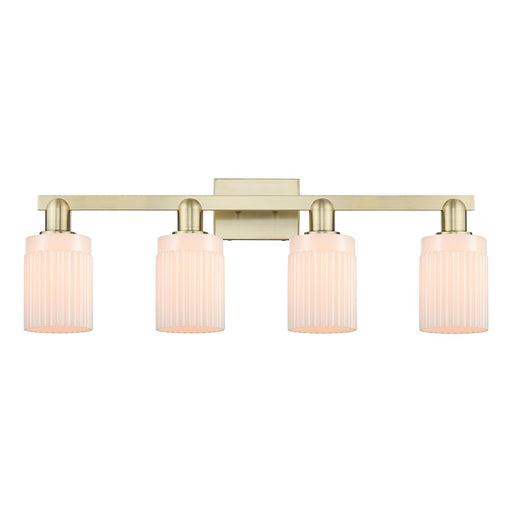 Innovations Hadley 32in 4-Light Bath Vanity Light | Industrial Antique Brass and Matte White Ribbed Glass | Bathroom Vanity | Model 716-4W-AB-G341