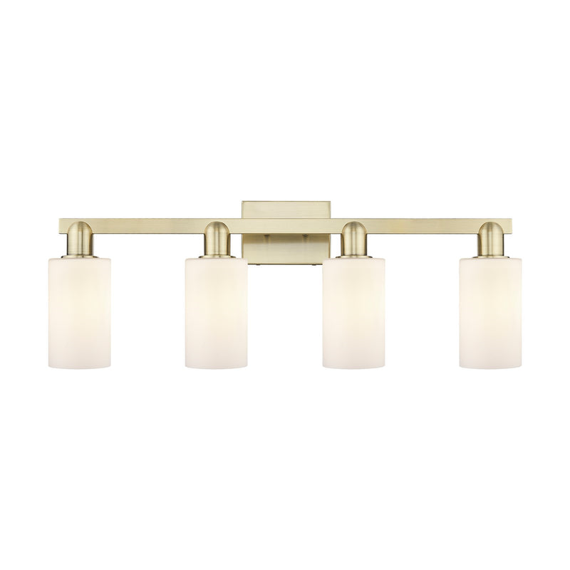 Innovations Clymer 31in 4-Light Bath Vanity Light | Industrial Antique Brass and Matte White Glass | Bathroom Vanity | Model 716-4W-AB-G801