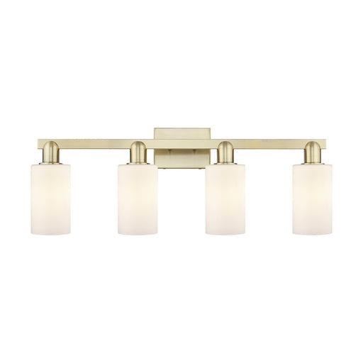 Innovations Clymer 31in 4-Light Bath Vanity Light | Industrial Antique Brass and Matte White Glass | Bathroom Vanity | Model 716-4W-AB-G801