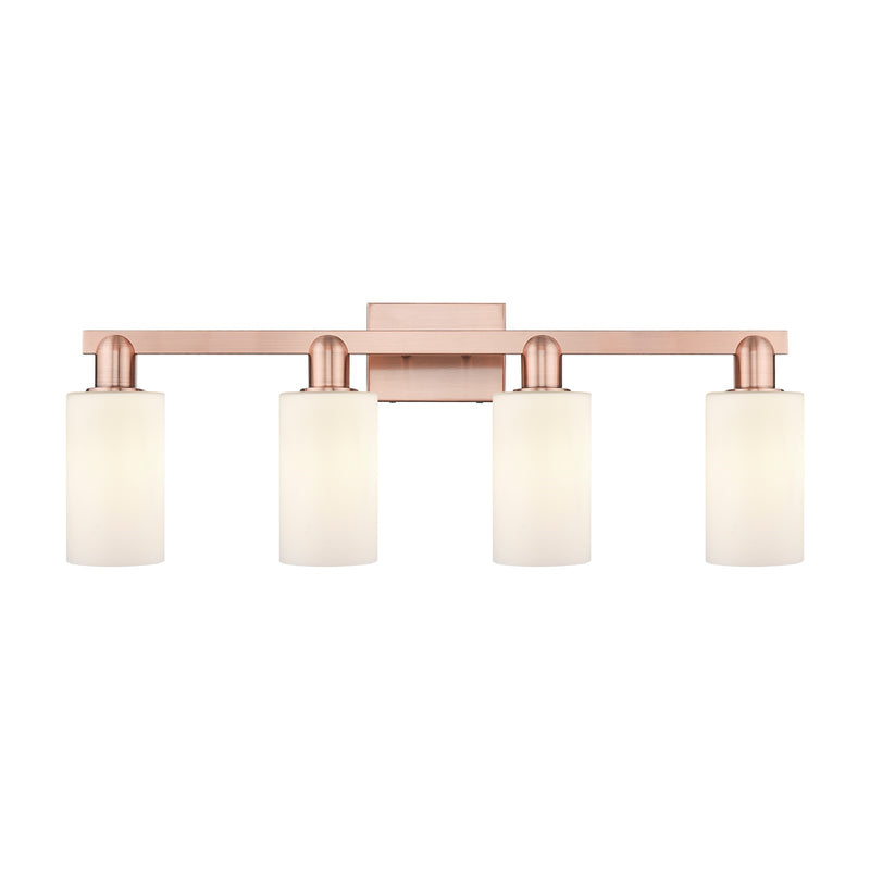 Innovations Clymer 31in 4-Light Bath Vanity Light | Industrial Antique Copper and Matte White Glass | Bathroom Vanity | Model 716-4W-AC-G801