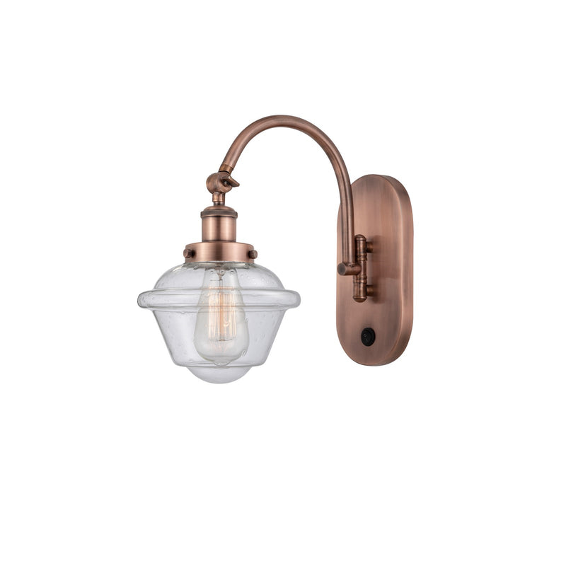 Innovations Oxford 1-Light Swing Arm Wall Sconce | Traditional Antique Copper Steel and Seedy Glass | Bedroom & Living Room | Model 918-1W-AC-G534-LED