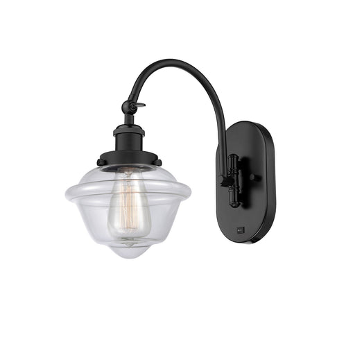 Innovations Oxford 8in 1-Light Swing Arm Wall Sconce | Industrial Matte Black Steel and Clear Glass | Bedroom Reading Light | Model 918-1W-BK-G532