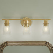 Kichler Stamos 22.25in 3-Light Bathroom Vanity Light | Modern Brushed Gold Steel and Clear Glass | Bathroom Vanity | 22.25 x 8.25 in | Model 55121BGCLR