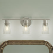 Kichler Stamos 22.25in 3-Light Vanity Light | Modern Brushed Nickel Steel and Clear Satin Etched Glass | Bathroom Vanity | 22.25 x 8.25 in | Model 55121NICLR