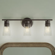 Kichler Stamos 22.25in 3-Light Vanity Light | Modern Olde Bronze Steel and Clear Satin Etched Glass | Bathroom Vanity | 22.25 x 8.25 in | Model 55121OZCLR