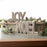 Melrose Beaded Wood Design Noel/Joy Sentiment, Set of 2, Brown/White