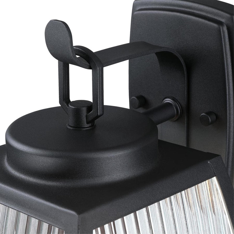 Westinghouse Niko 8in 1-Light Outdoor Sconce | Industrial Textured Black and Clear Ribbed Glass | Entryway & Porch | 8 x 9 x 13 in | Model 6122400