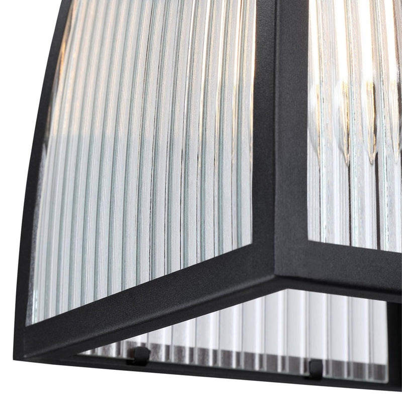 Westinghouse Niko 8in 1-Light Outdoor Sconce | Industrial Textured Black and Clear Ribbed Glass | Entryway & Porch | 8 x 9 x 13 in | Model 6122400