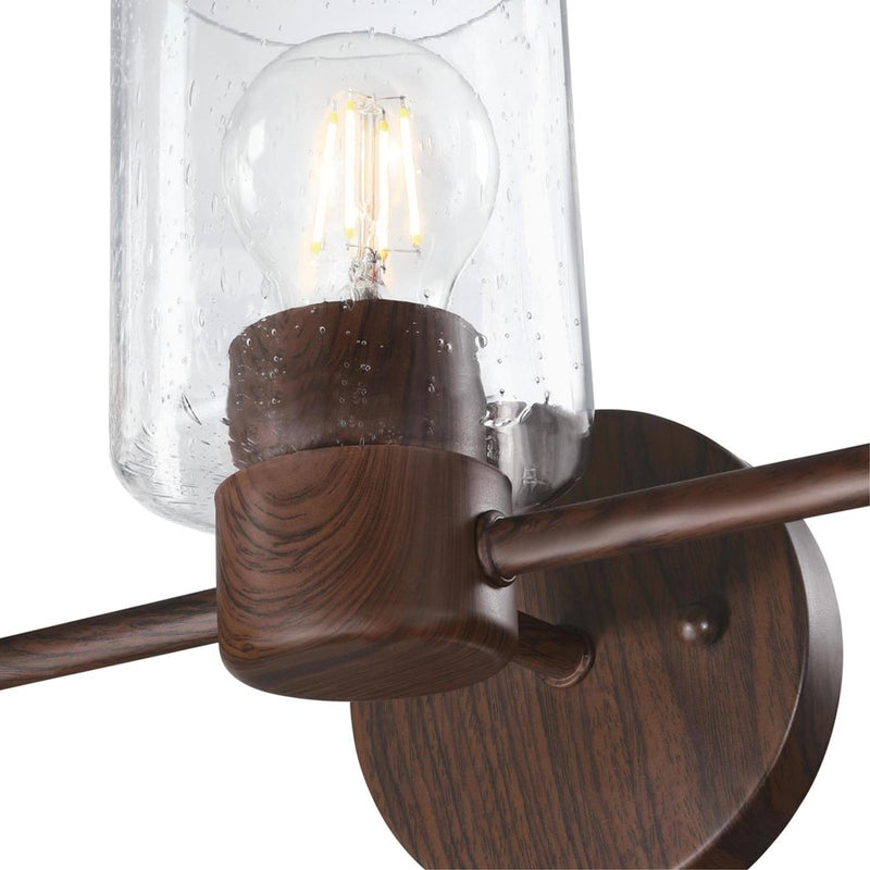 Westinghouse Sylvestre 3 Light Wall Light, Walnut/Clear Seeded Glass