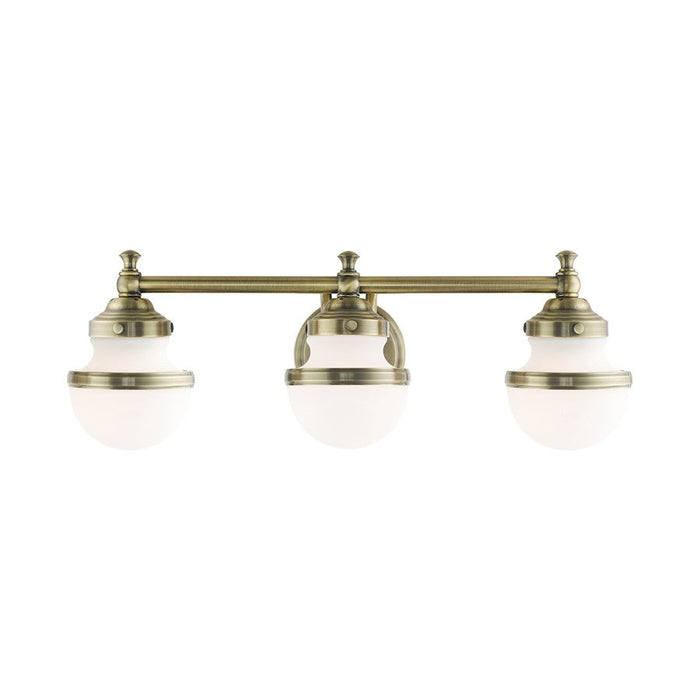 Livex Oldwick 3 Light Vanity Sconce, Antique Brass/Satin Opal White - 5713-01