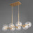 Quorum Rovi 8 Light Linear Chandelier, Aged Brass/Clear